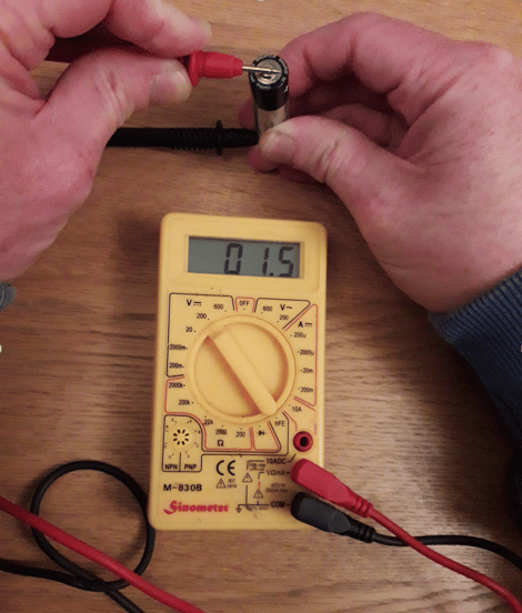 Checking battery voltage using a multimeter